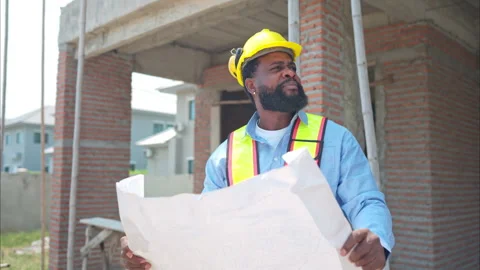 Portrait of engineers work together to assess the residential home Stock Footage 308922895