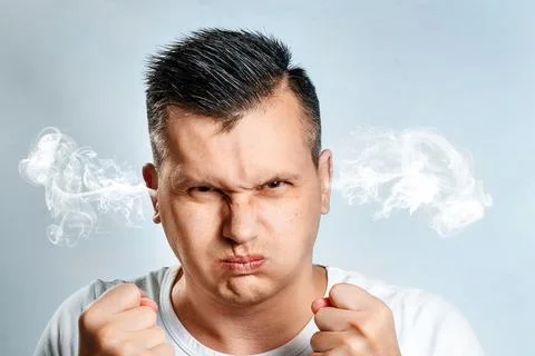 Portrait of an evil man whose steam comes out of his ears. The concept of fru Stock Photos