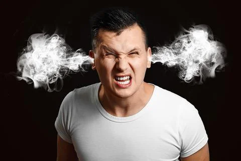 Portrait of an evil man whose steam comes out of his ears. The concept of fru Stock Photos