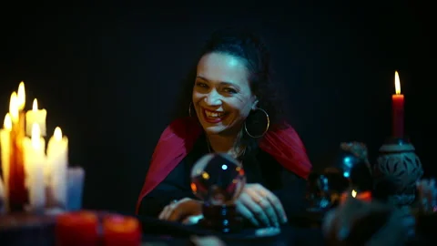 Portrait of evil oracle laughing in front of crystal ball, psychic, witchcraft Stock Footage 197992540