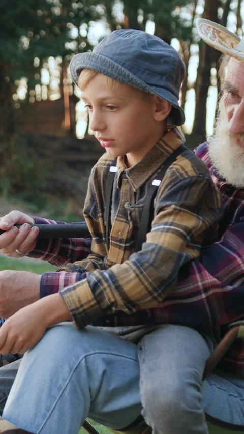 Portrait of experienced likable elderly grey-bearded grandpa which holding on kn Stock Footage 329183377