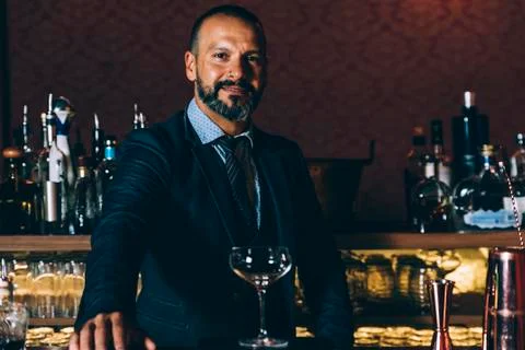 Portrait of expert barman. Stock Photos