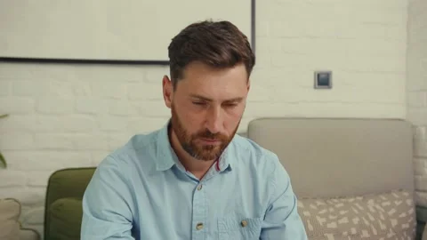 Portrait face attractive man looking at camera serious worker laptop sitting on Stock Footage 132541481