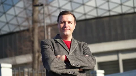 Portrait face caucasian man looking at camera enjoying in urban city lifestyle Stock Footage 168322997