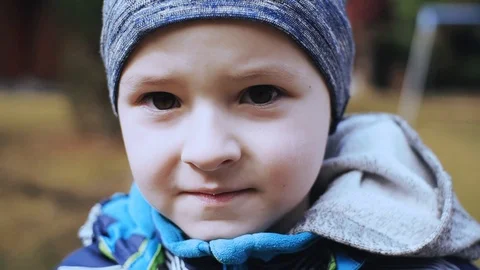 Portrait the face of a child with hat look at camera happy and smiling boy male Stock Footage 121066461