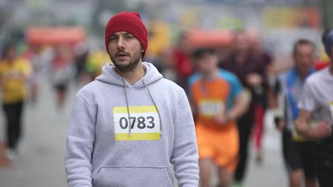 Portrait face of tired athlete runner on marathon standing, looking at camera. Stock Footage 166495201