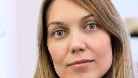 Portrait of the face of a young pretty charming girl with big eyes. kind look Stock Footage 82496501