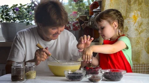 Portrait of faces, hands happy granny, granddaughter. toddler girl play with Stock Footage 111486767