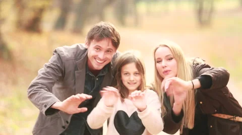 Portrait of family waving in park Stock Footage 59554282