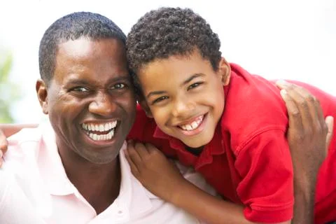 Portrait Of Father And Son In Park Stock Photos