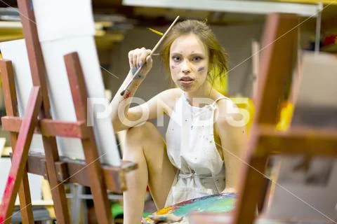 Portrait Of Female Artist Painting In Studio Stock Photos