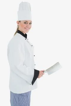 Portrait of female chef with meat cleaver Stock Photos