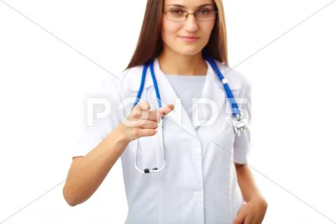 Portrait of female doctor with stethoscope pointing at you Stock Photos