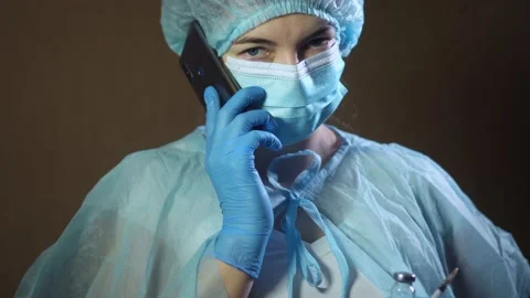 Portrait of Female Doctor using Smartphone Stock Footage 146738853
