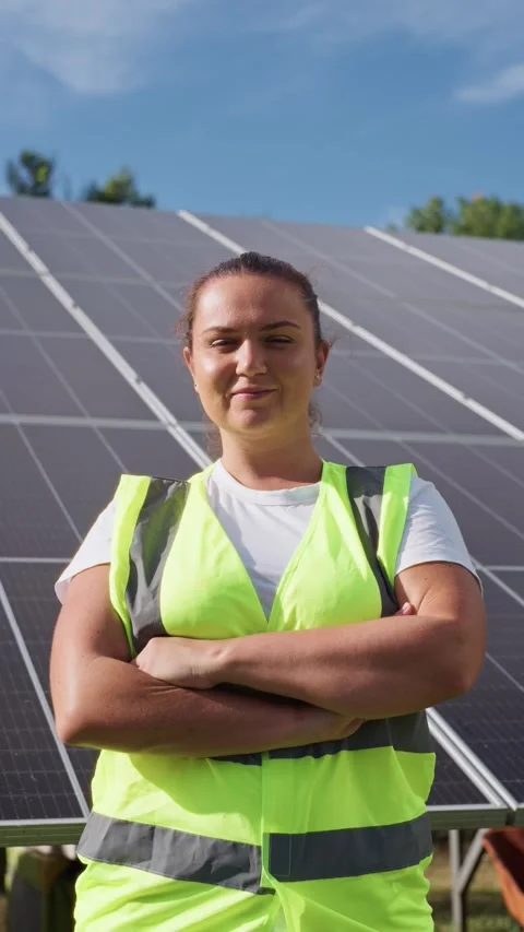 Portrait of a female engineer against the background of solar panels. Stock Footage 292282006