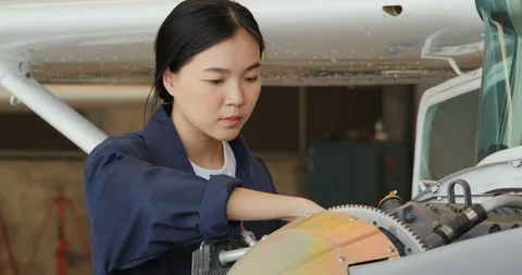 Portrait of Female engineer or pilot looking in airplane. Video stock 124656438