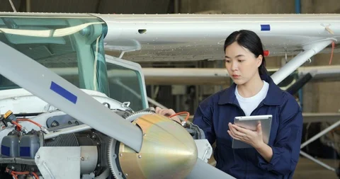 Portrait of Female engineer or pilot using tablet to research information. Stock Footage 124775942