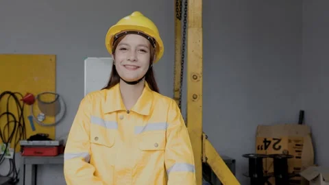 Portrait Female Engineer Smiling Looking At Camera Safety Helmet Industrial.. Stock Footage 347724898