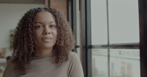Portrait of Female Looking at Camera in Loft Apartment Stock Footage 237750151