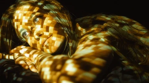 Portrait of female model with projected disco ball pattern. Gold. Stock Footage 89659290