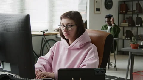 Portrait of Female Software Developer Working on Tablet App in Office Stock Footage 335938180