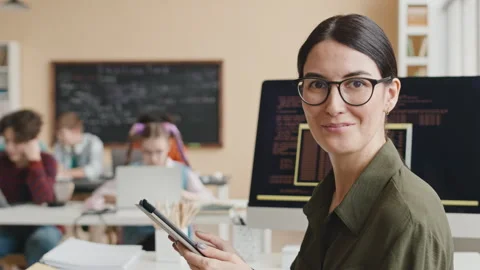 Portrait of Female Teacher of Programming in Computer Class Stock Footage 248533447