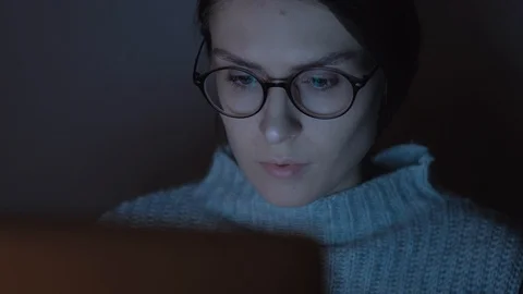Portrait of a female working at the computer at night. Stock Footage 102365124