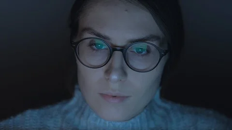 Portrait of a female working at the computer at night. Video stock 102365477