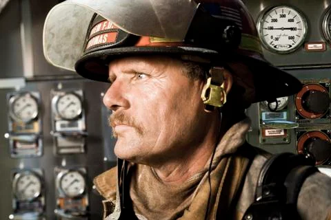 Portrait of a firefighter in front of control panel Foto stock