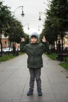 Portrait of a five-year-old boy in the city in the fall. Stock Photos