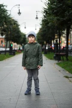 Portrait of a five-year-old boy in the city in the fall. Stock Photos