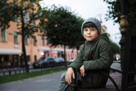 Portrait of a five-year-old boy in the city in the fall. Stock Photos