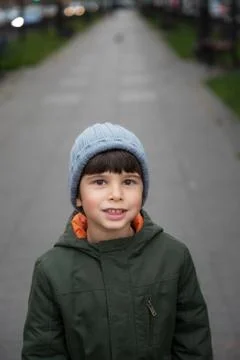 Portrait of a five-year-old boy in the city in the fall. Stock Photos