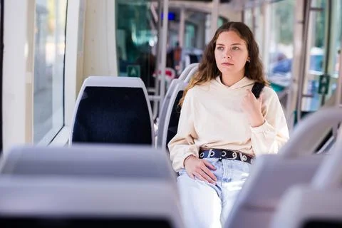 Portrait of a focused girl riding on public transport Stock Photos