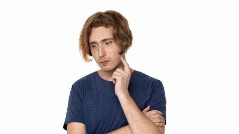 Portrait of focused hairy guy in basic t-shirt with brooding look thinking hard Stock Footage 89022894
