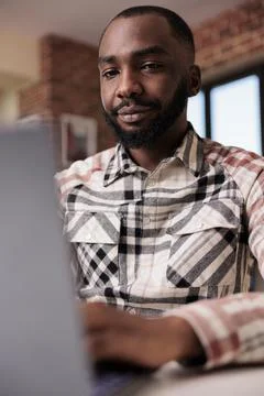 Portrait of focused programmer writting code typing on laptop keyboard sitting 스톡 사진
