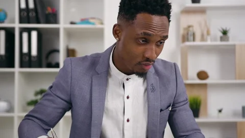 Portrait of focused responsible black-skinned bearded office manager which Stock Footage 132101715