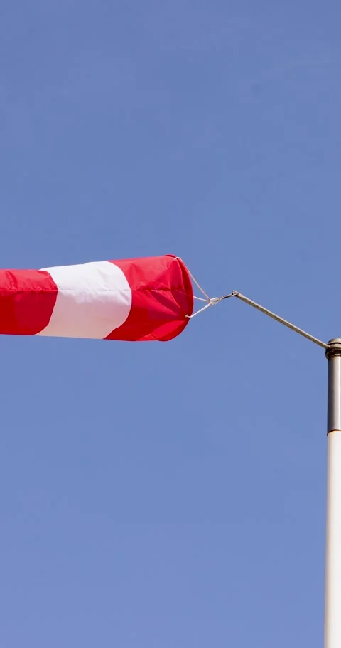 Portrait footage of a wind sock with wind blowing through the sleeve on a c.. Stock Footage 270496183