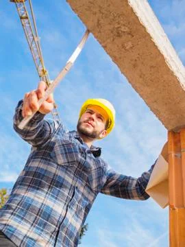 Portrait of foreman with construction plan and pocket rule checking construktion Stock Photos