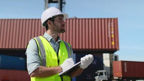 Portrait of foreman or cargo container worker work in workplace area then smile Stock Footage 146476404