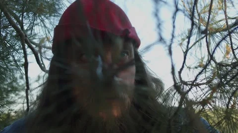Portrait in the forest A man with a beard in a medieval knight costume peering Stock Footage 277722638