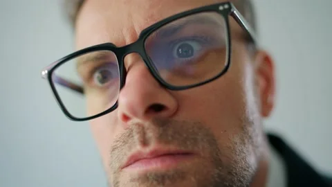Portrait of a formally dressed man in glasses, looking persistently into the Stock Footage 201973379