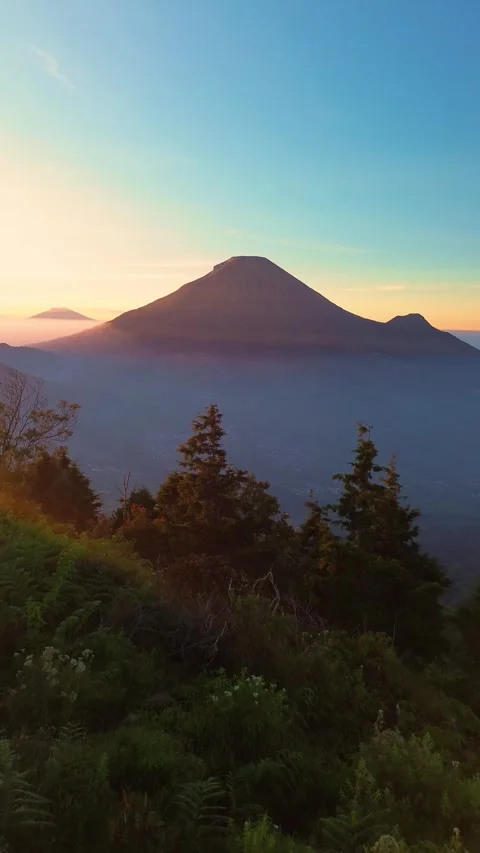 This portrait-format drone footage of the mountain was captured on a clear day. Stock Footage 343085934