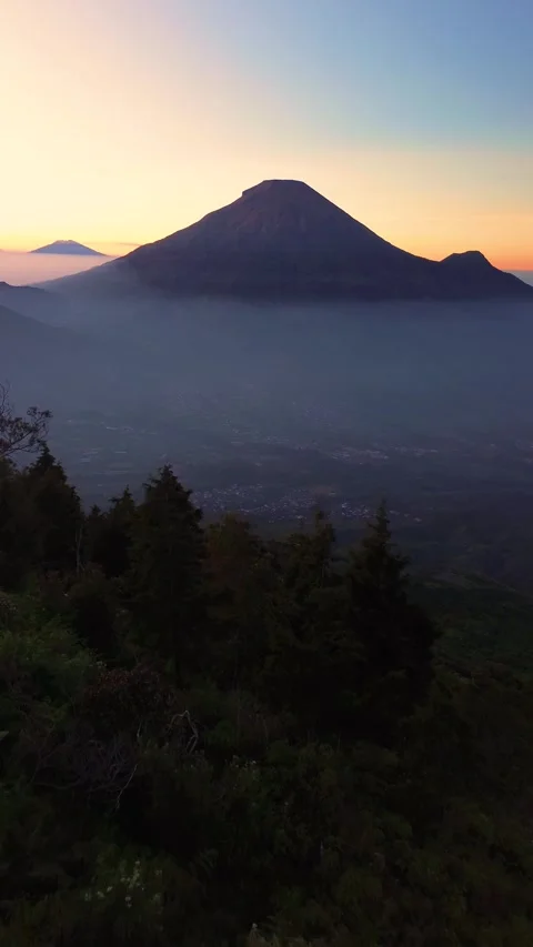 This portrait-format drone footage of the mountain was captured on a clear day. Stock Footage 343086019