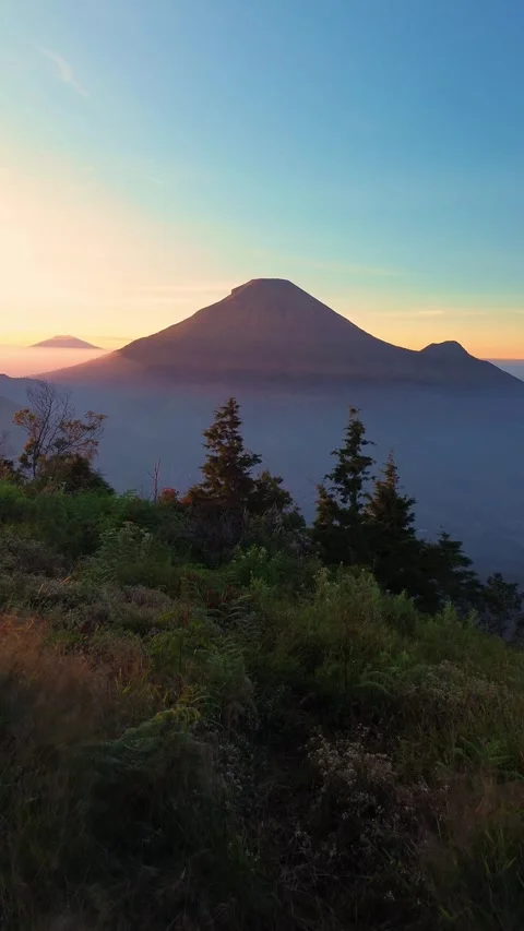 This portrait-format drone footage of the mountain was captured on a clear day. Stock Footage 343086020