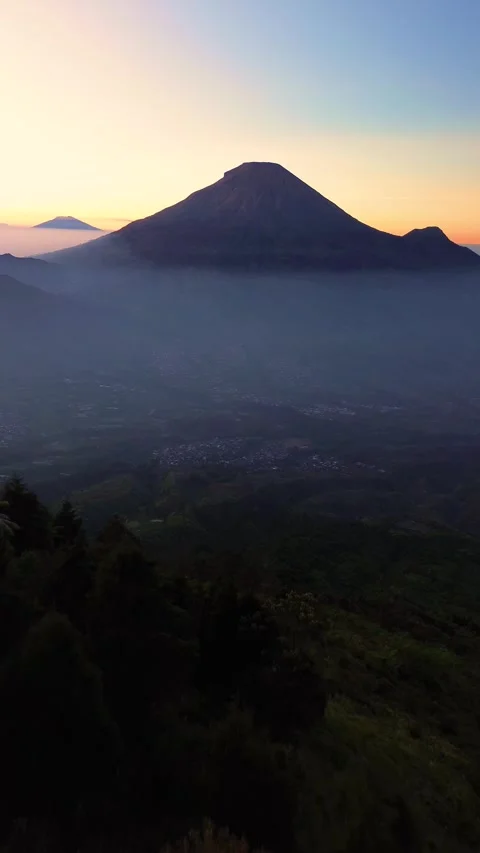 This portrait-format drone footage of the mountain was captured on a clear day. Stock Footage 343086118