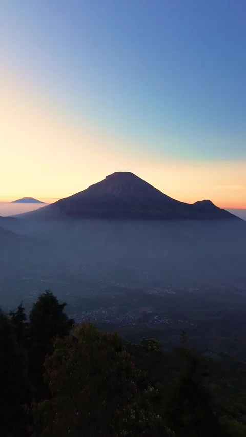 This portrait-format drone footage of the mountain was captured on a clear day. Stock Footage 343086198