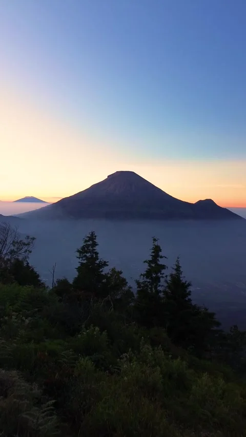 This portrait-format drone footage of the mountain was captured on a clear day. Stock Footage 343086268