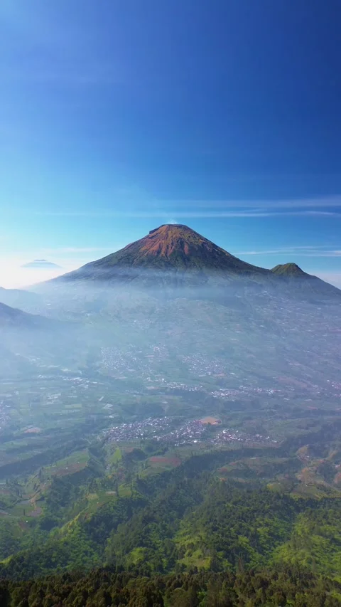 This portrait-format drone footage of the mountain was captured on a clear day. Stock Footage 343090419