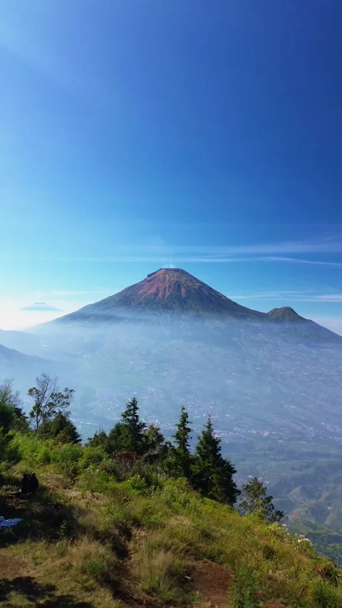 This portrait-format drone footage of the mountain was captured on a clear day. Stock Footage 343090427